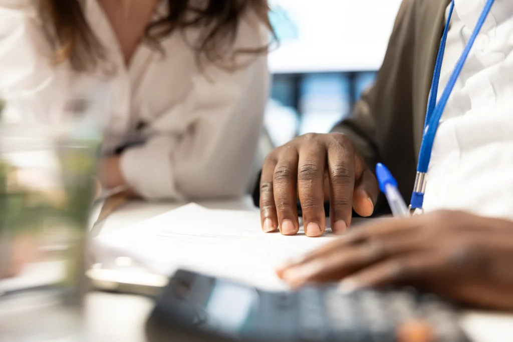 Accountant reviewing financial documents with a medical practice owner